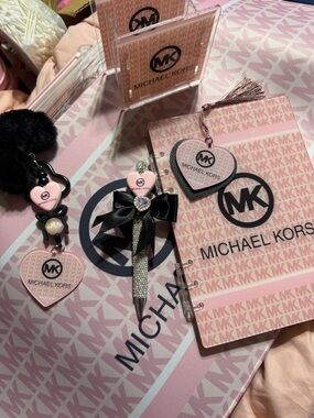 Pink large desk mat, matching notebook, pen holder, pen and keychain set.